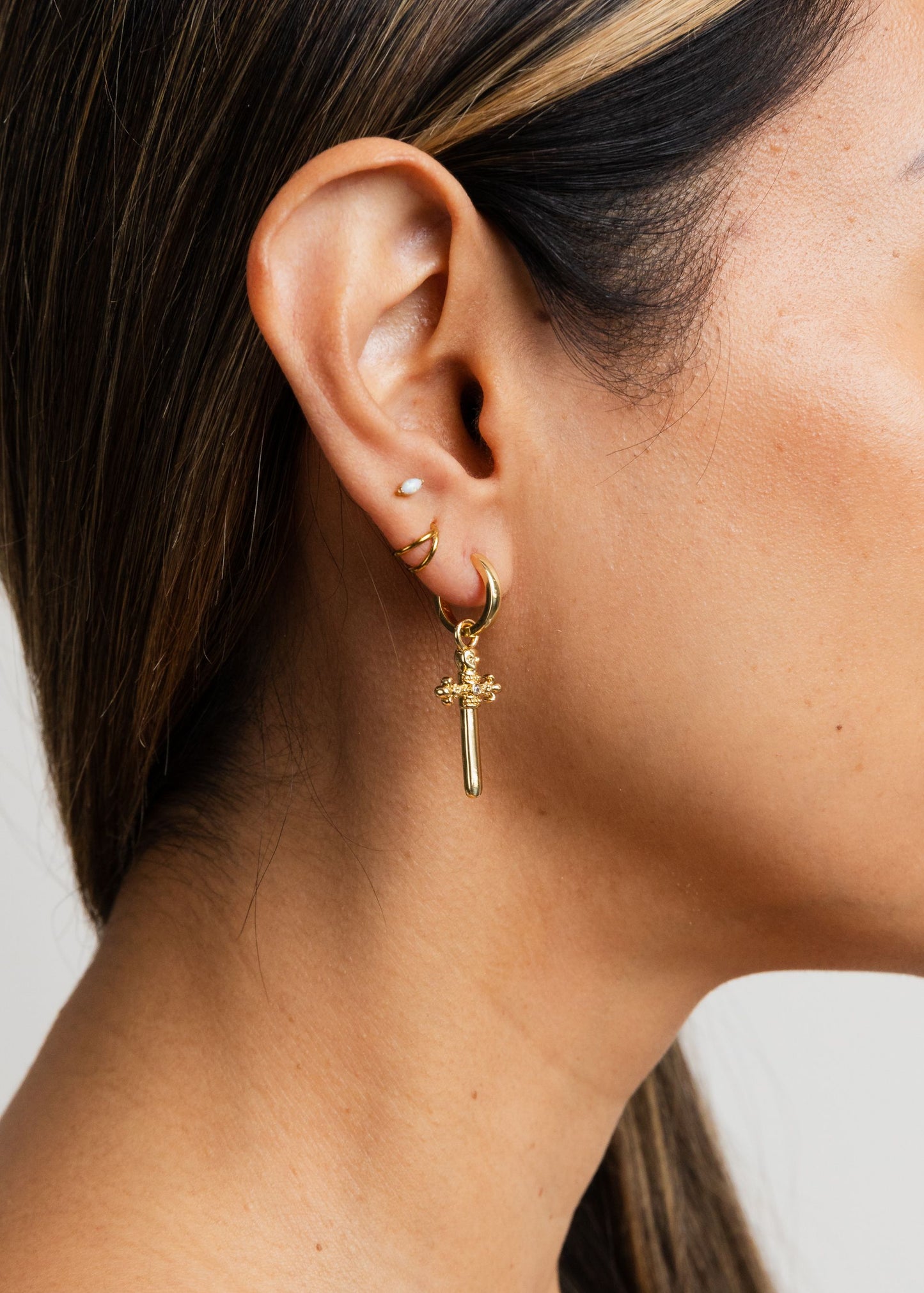 dangling daggered cross earrings